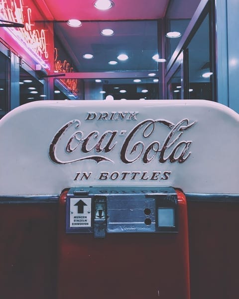 coca cola logo on machine